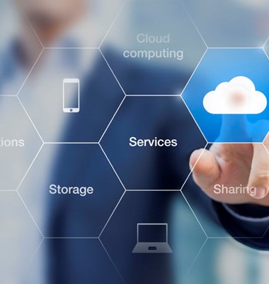 Stock image of a clear glass touchscreen and man pressing a cloud icon